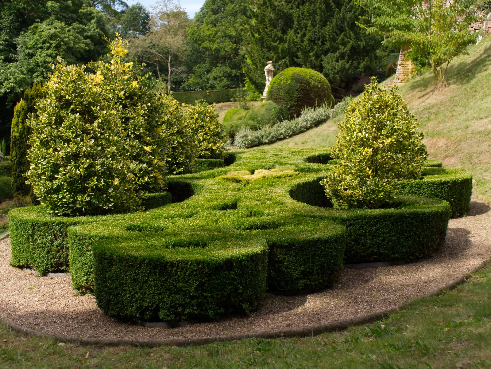 Sculpted knot garden with neatly trimmed hedges